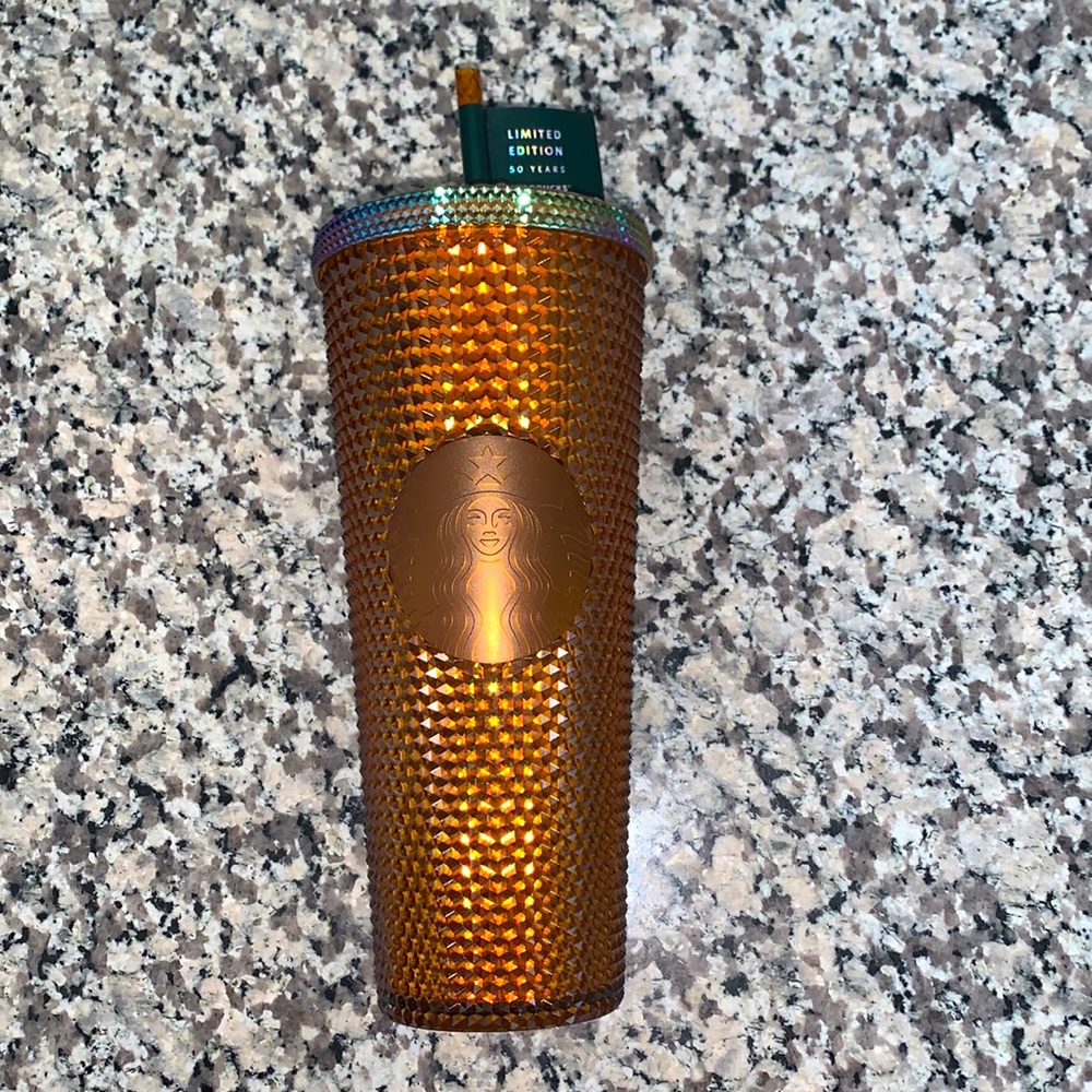 One of a kind, limited edition gold Starbucks tumbler.